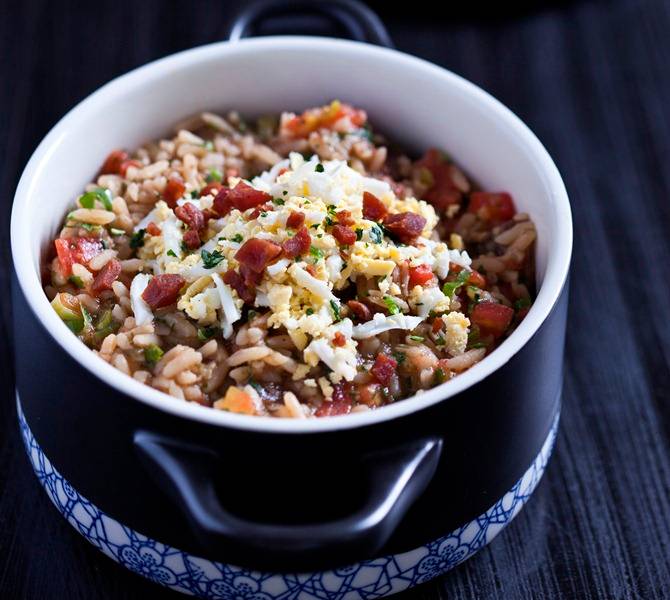 O arroz de carreteiro da casa é úmido O arroz de carreteiro da casa é úmido