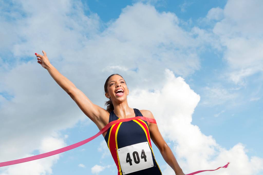 Female athlete crossing the finish line