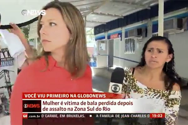 Bala perdida interrompe reportagem, assusta jornalista e fere pedestre