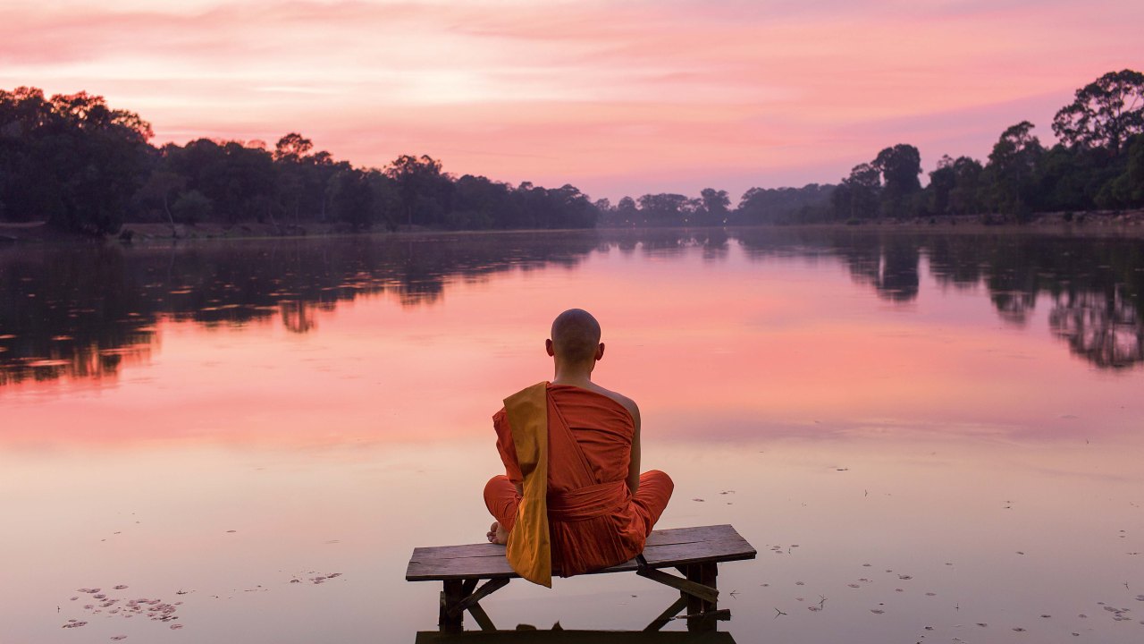 Cambodia, Angkor Wat, Buddhist Monk at sunset