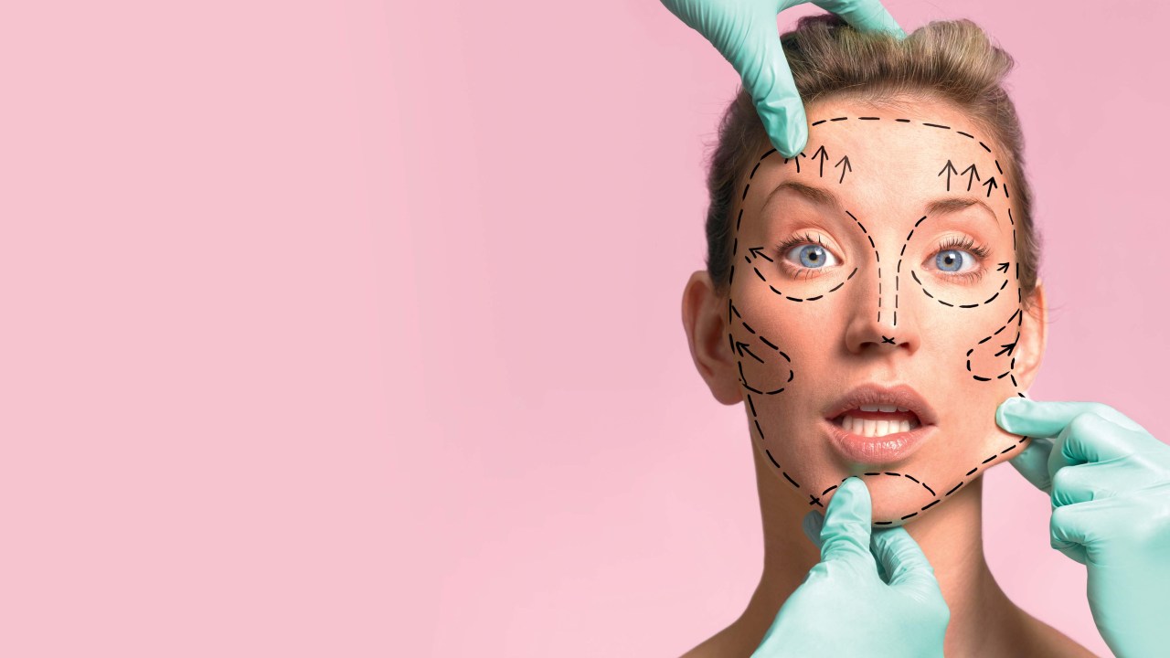 Plastic surgeon marking up for surgery