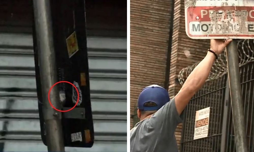 Placa de trânsito com um pacote de droga preso entre a placa e o cano preso ao chão
