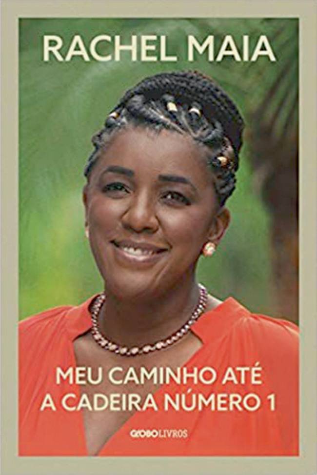 Capa do livro Meu Caminho até a Cadeira Número 1. Mostra a mulher negra Rachel Maia sorrindo para a câmera