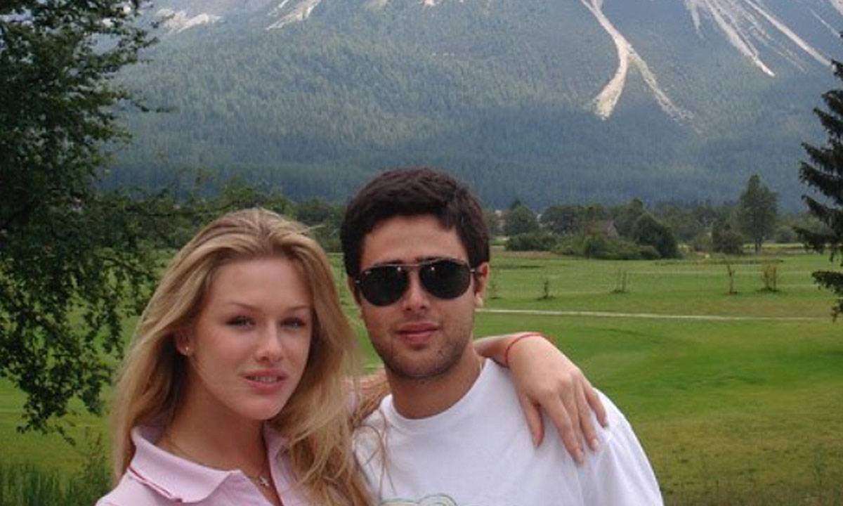 Fiorella Mattheis e Roberto Marinho Neto, abraçados em cenário montanhoso ao fundo.