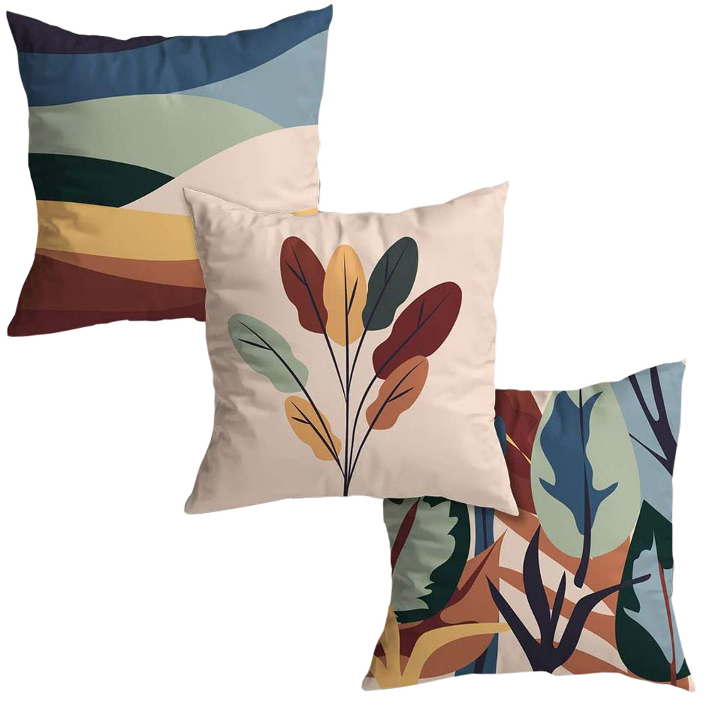 tr&ecirc;s capas de almofada com estampas coloridas