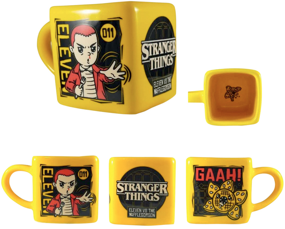 Caneca.jpg Caneca amarela e quadrada inspirada em Stranger Things. A estampa possui uma ilustração da Eleven e dos monstros da primeira temporada