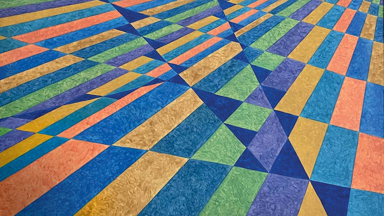 Imagem mostra pintura geométrica, colorida