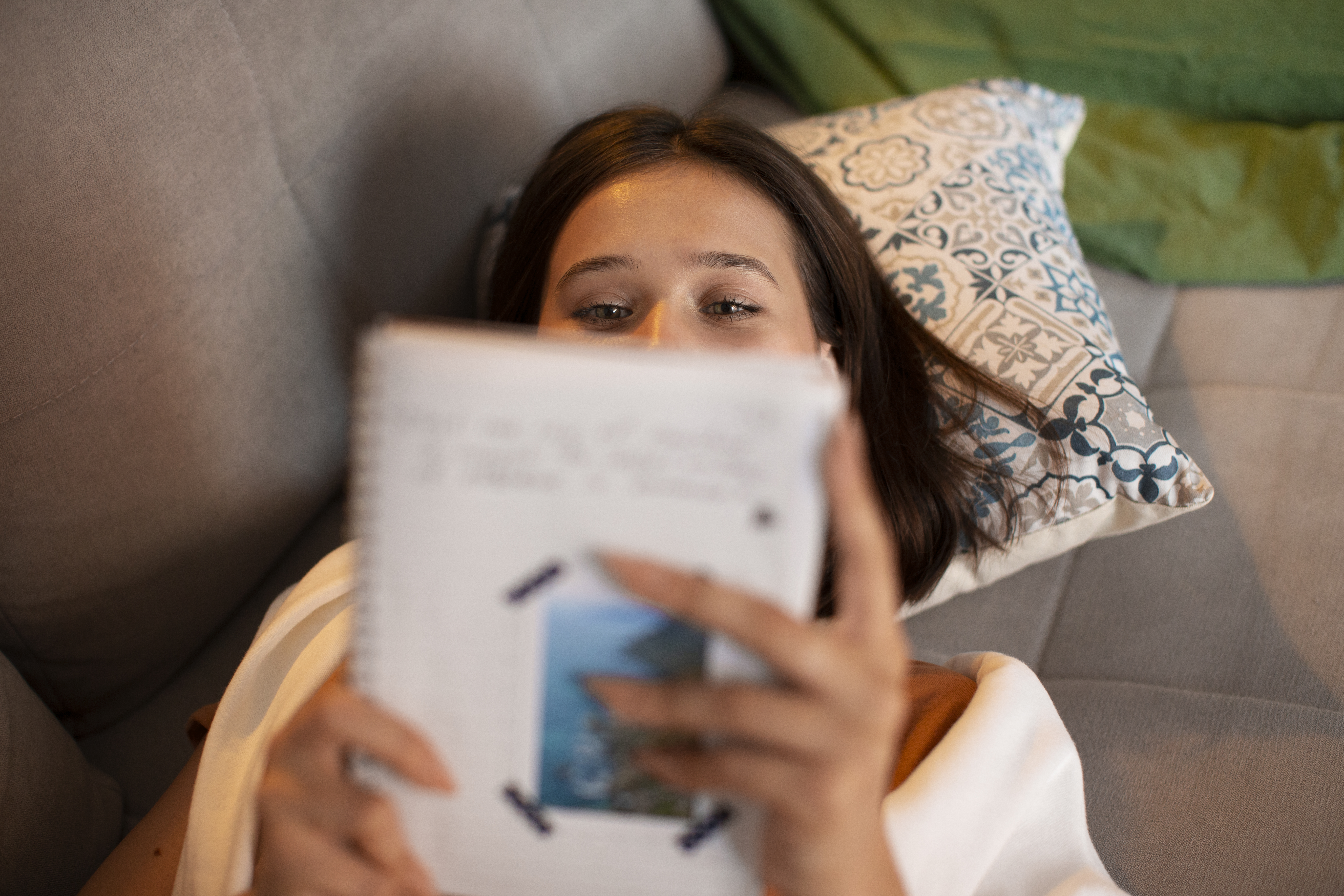 high-angle-woman-doing-creative-journaling